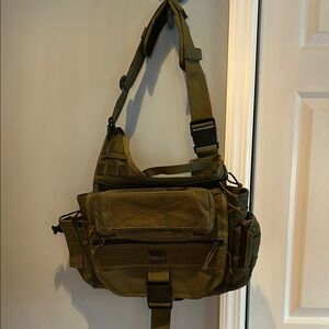 Green tactical Messenger Bag with Adjustable Strap and Durable Fabric.